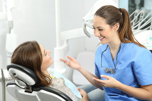 Patient talking to a friendly dentist